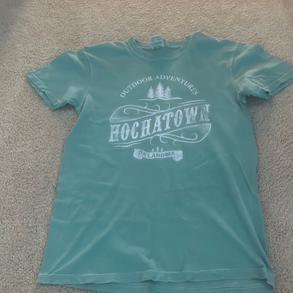teal/green/blue shirt